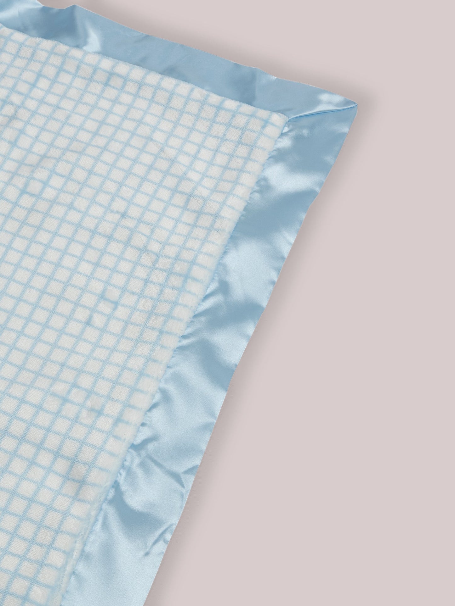 Mr. Happy Reversible Blanket showing reverse side and satin corner